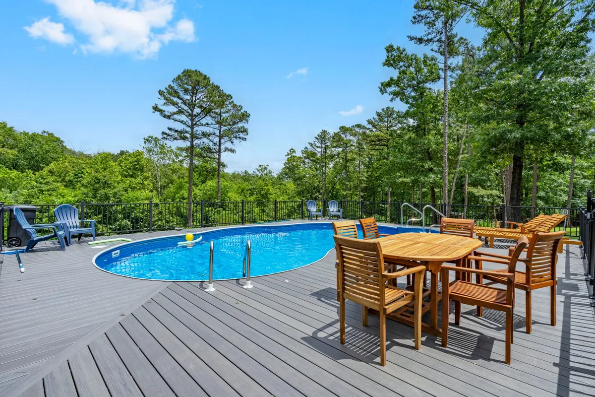 The community saltwater swimming pool, surrounded by forest and comfortable lounge areas. The pool is shared by only a few homes, promising a relaxed, intimate atmosphere for families to enjoy together.